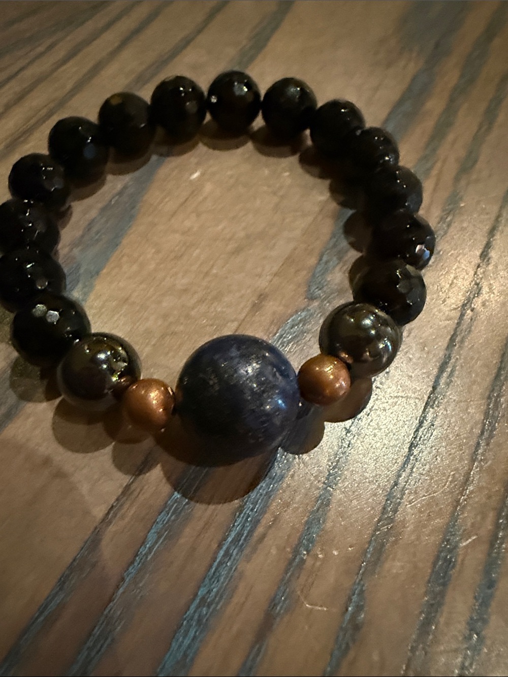 Lapis Lazuli Accent Beaded Stretch Bracelet with Black and Brown beads.